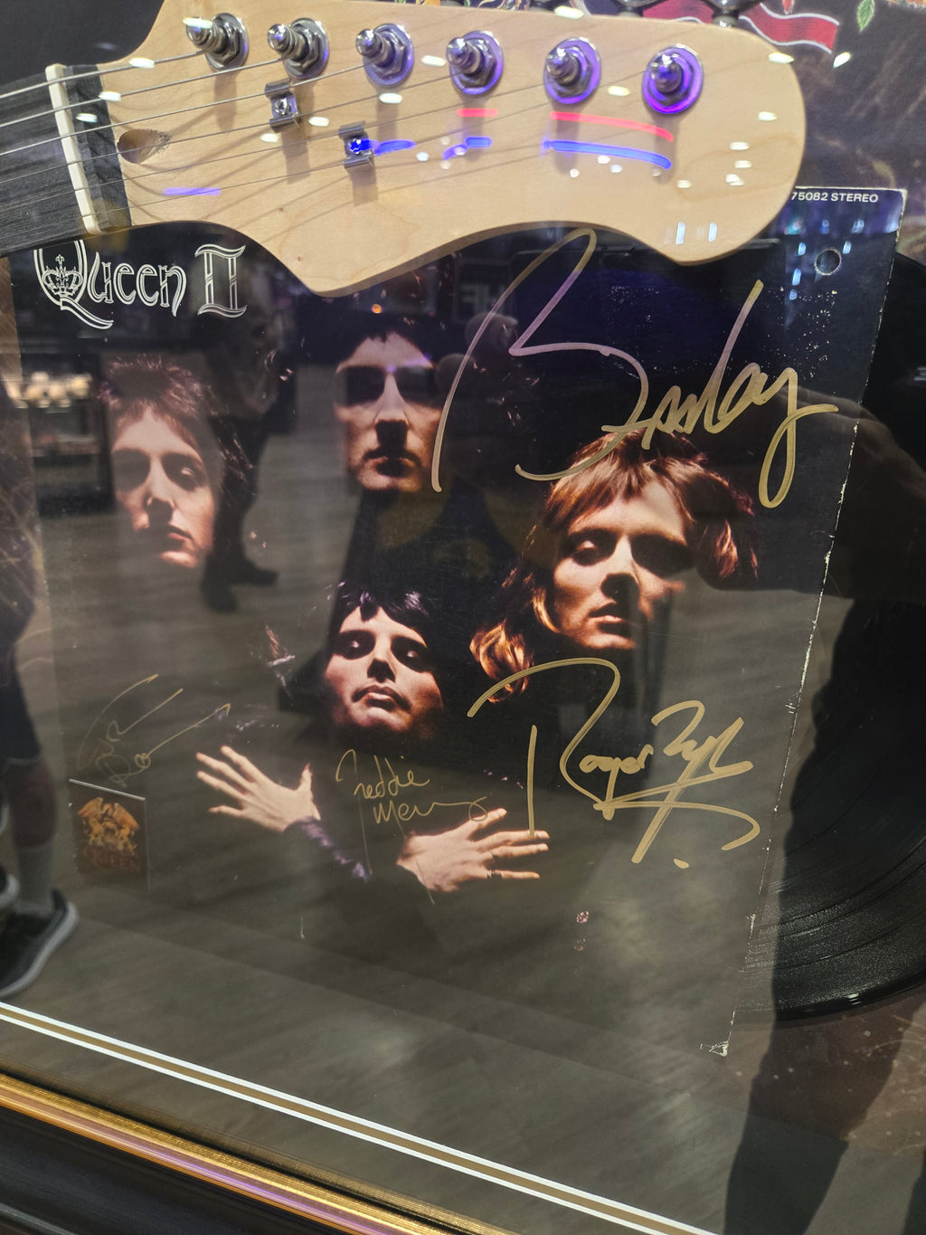 Queen Guitar / microphone with hand signed by band album .