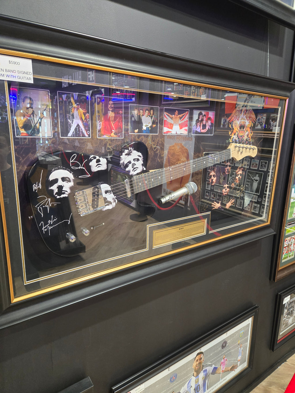 Queen Guitar / microphone with hand signed by band album .